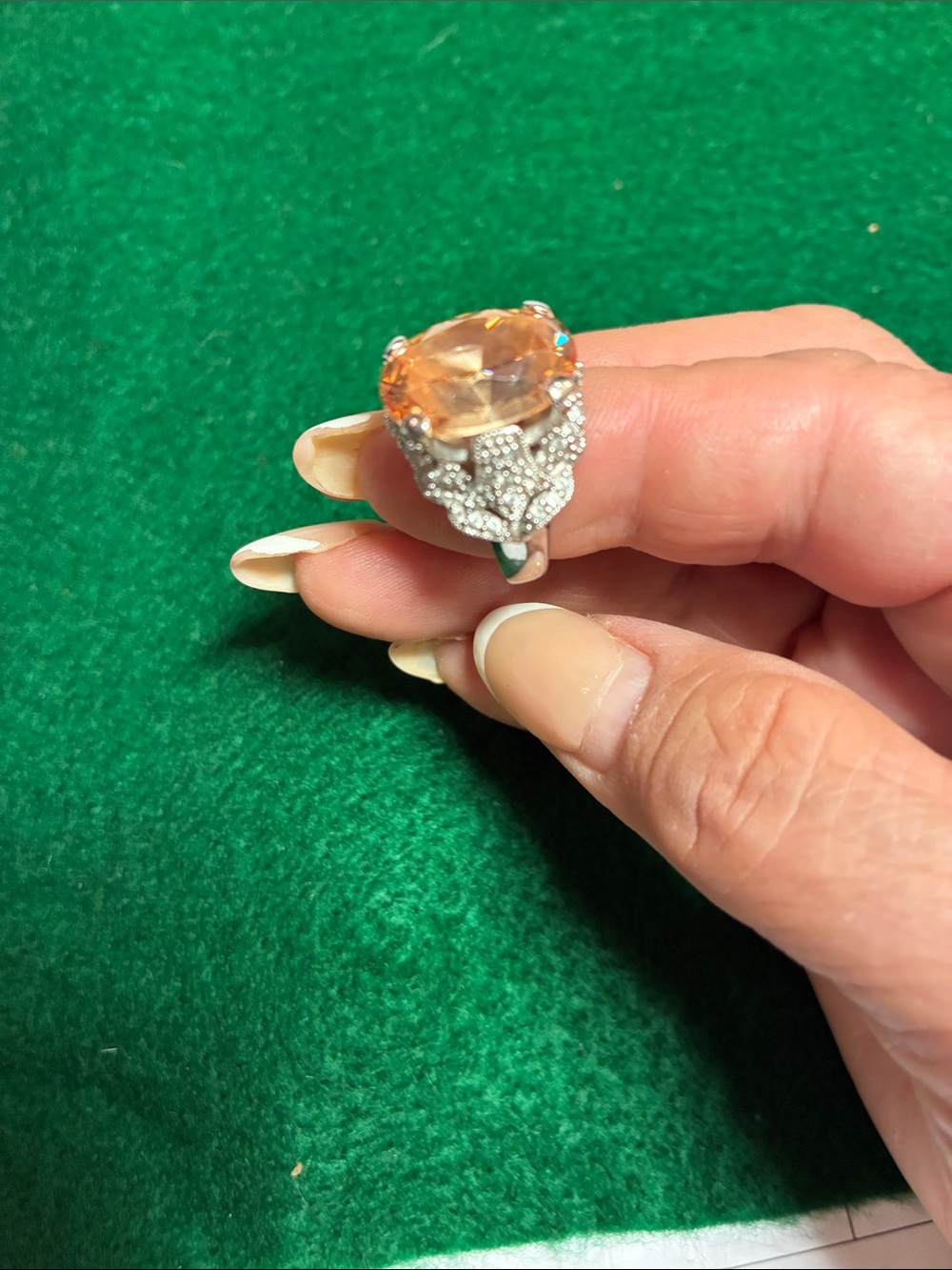 Ornate Silver-Tone Ring with Orange Center Gem